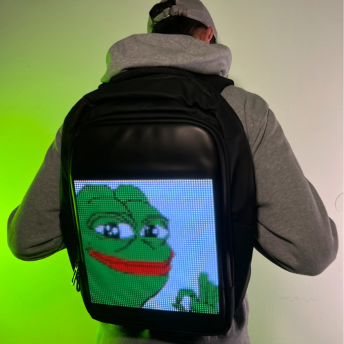 A person wearing a backpack with a customizable LED screen on the back, controlled via a smartphone app.